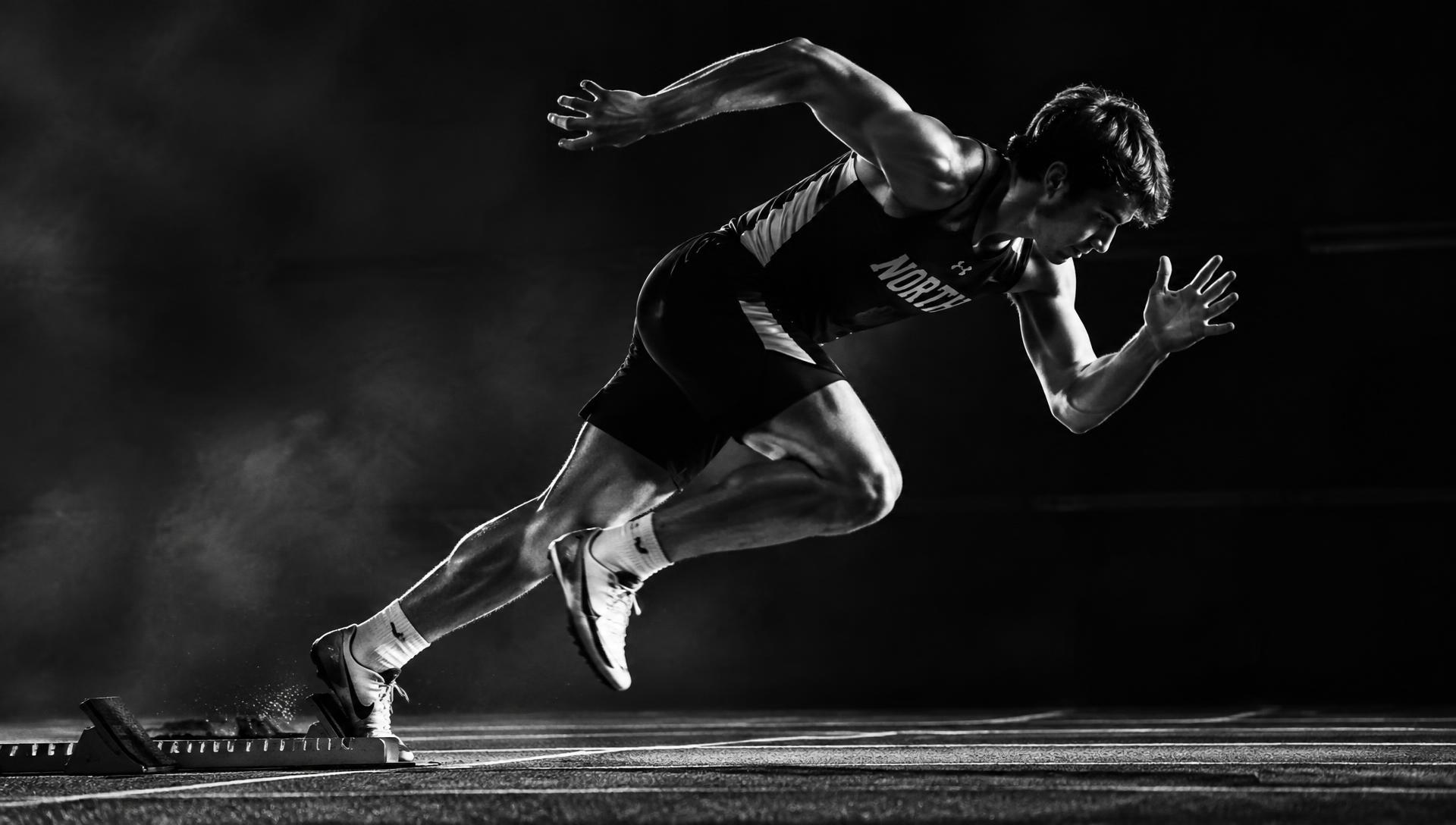 Athlete driving out of the blocks